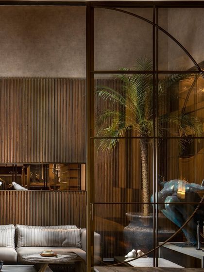 The partition system works in concert with other architectural elements, like the recessed wall niche. This demonstrates my holistic approach to ensuring all components of a space are in perfect harmony.