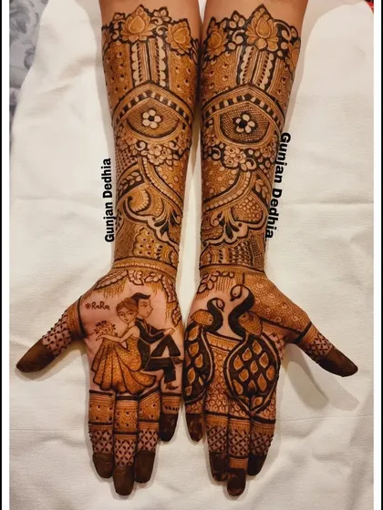 A clear shot of the engagement mehendi for my client Ravina, showcasing the dancing couple and peacock motifs.