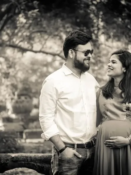 A classic black and white couple's portrait in a park. The style gives a timeless feel to this happy memory.