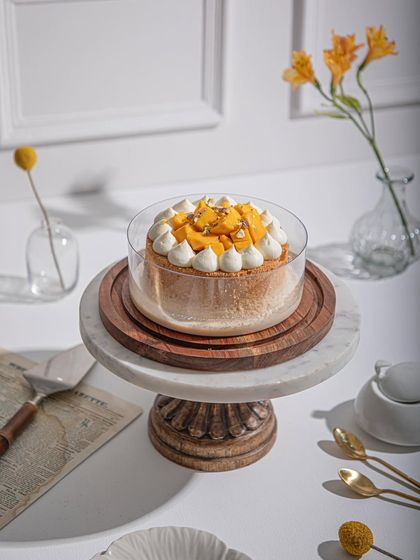 Our Mango Tres Leches with a whipped cream topping, a lighter option for mango lovers.