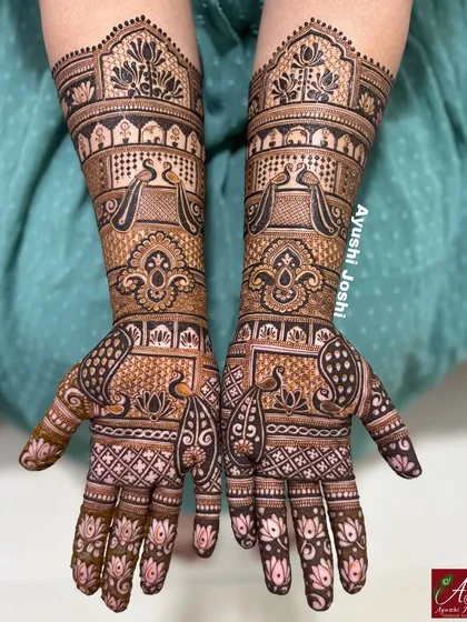A beautiful engagement mehendi with a focus on peacocks and lotuses. The patterns are intricate and flowing, perfect for celebrating a special milestone.