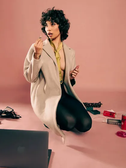 A candid-style shot from the "Hot Mess" editorial. It captures a moment of being caught off-guard, adding a layer of realism to the fashion story.