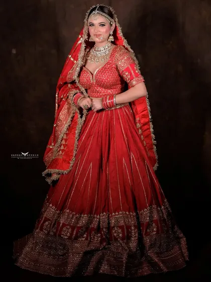A poised, full-length portrait showcasing the complete bridal ensemble.