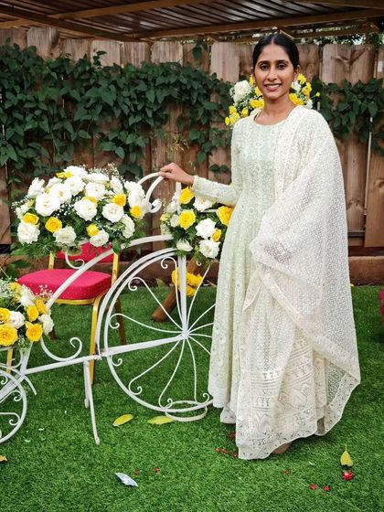 Another beautiful shot of the client in her Chikankari gown, highlighting the flow and grace of the outfit.