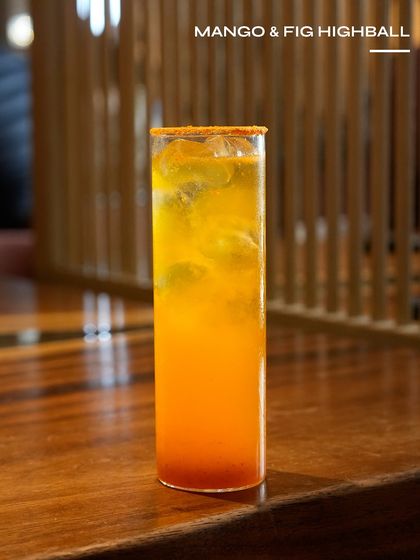 The Mango & Fig Highball, a fruity and vibrant drink from one of our limited menus. The sweet mango and earthy fig create a beautifully balanced flavour profile.