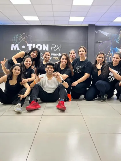 This is my tribe! A happy moment with my amazing ladies' batch after nailing a routine. My studio is all about this supportive, fun community where everyone feels welcome.