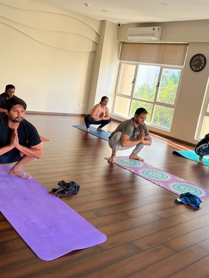 Finding grounding and strength in Malasana (Garland Pose). It’s a powerful moment when the entire class sinks into the pose together.