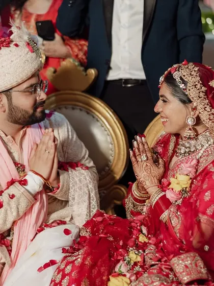 A moment of prayer and gratitude during the wedding ceremony. This image captures the spiritual and emotional depth of the day.