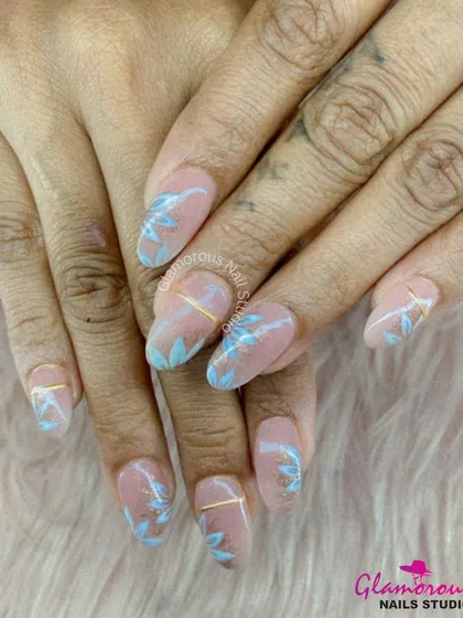This design is all about understated elegance. On a clean, nude base, we hand-painted delicate, leafy branches in a soft baby blue, with a thin gold line adding a touch of modern sophistication.