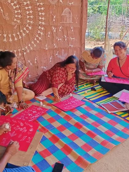 A candid moment of learning and laughter during our Warli art retreat. We believe in creating a relaxed and joyful atmosphere for our students to explore their creativity.