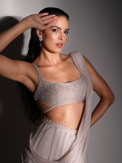 A close-up portrait from the shoot with Natasa Stankovic. This shot captures the intricate detailing of the embellished blouse and the modern, confident energy of the overall look.