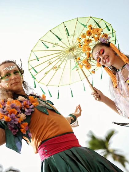 Performers in ethereal, nature inspired costumes with parasols greet guests and add to the festival like atmosphere of the poolside Haldi.