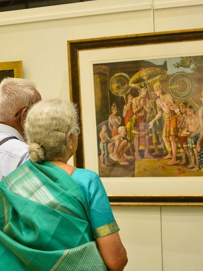 Visitors admiring a historical painting. We are sharing these snapshots to celebrate the incredible moments we've shared with all of you over the past 60 days.