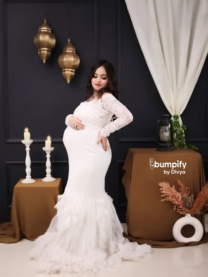 Another gorgeous solo pose in the white lace gown. This shot beautifully captures the graceful curve of the baby bump.