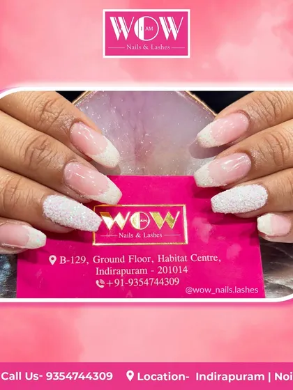 A classic French ombré on almond-shaped extensions, with a textured, sugary glitter finish on the white tips. This design adds a unique tactile element to a timeless style.