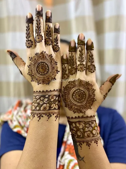 A happy client showing off her beautiful mandala mehendi. This style is timeless and suits every occasion.