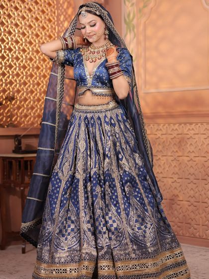 Three shots of a model in a royal blue Banarasi lehenga. These images showcase the outfit's rich texture and how it can be styled for a majestic, traditional photoshoot.
