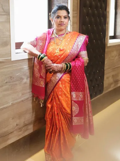 A full-length view showcasing the elegance of the Paithani saree. The makeup is designed to be flawless from every angle, ensuring the bride looks and feels her best.