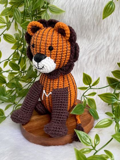 A unique lion created from a child's drawing! I love bringing your creative ideas to life. This striped lion with the initial 'M' is a truly one-of-a-kind creation.