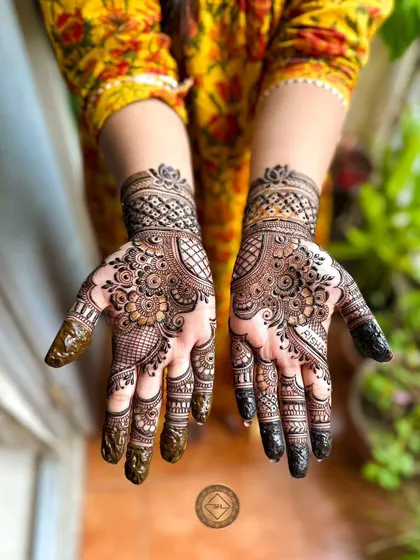 A full and festive Karwa Chauth henna design for a lovely client. I love creating these dense, detailed patterns that cover the hands, filled with traditional motifs perfect for celebrating special occasions.