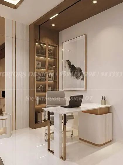 A luxurious home office or study area within a larger bedroom. The design features a marble-and-metal desk, elegant pendant lighting, and a glass-fronted bookshelf for a sophisticated workspace.