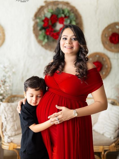 A close-up of a son hugging his mom's baby bump. These are the candid, emotional moments that families will treasure for years to come.