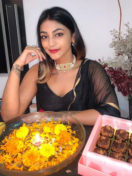 Celebrating Diwali with a simple and elegant look. I paired a classic black saree with a gold border with a beautiful pearl and ruby choker.
