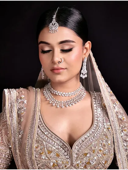 A stunning nude makeup look with shiny blush and glossy lips for that perfect fresh and modern feel. This style is perfect for a minimalist bride.