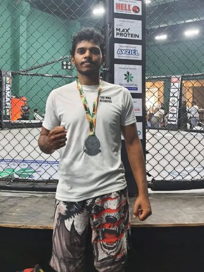 Posing with my Silver medal inside the cage at the BJJ Nationals in Mumbai. Competing in a cage environment is a different kind of pressure.