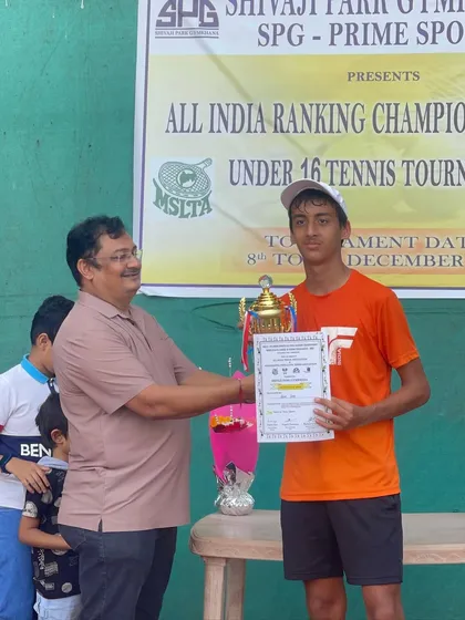 A well-deserved victory. 15-year-old Kabir Jaitly receives his winner's trophy at the All India Ranking Championship Series Under 16 Tennis Tournament.