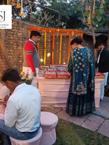 A full view of our Mehendi ceremony setup. We manage everything from the decor and seating for the bride to arranging the Mehendi artists and entertainment like bangle makers.