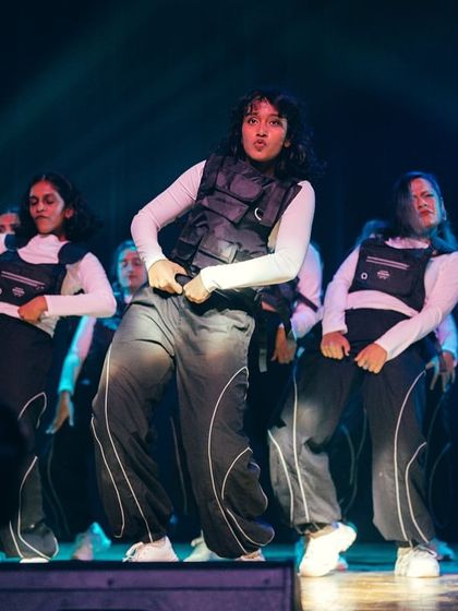 The entire crew hits a powerful pose, showcasing the attitude and style that defines our hip-hop performance batches.