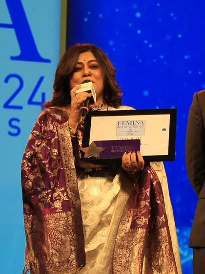 Holding my Femina award and speaking to the audience. It was a special night celebrating the achievements of women from various fields.