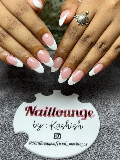 A classic and clean French manicure on perfectly shaped almond nails.