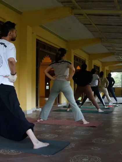 Participants exploring Warrior poses in our Dehradun shala. It's a joy to witness students finding their strength and stability in these foundational asanas.