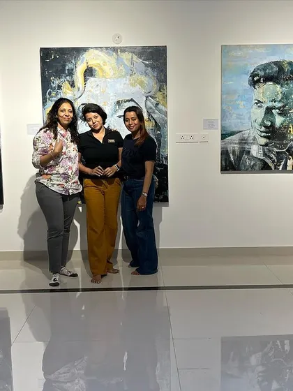 A candid moment from an art soirée, capturing the friendly and welcoming atmosphere we cultivate. Our goal is for you to leave feeling inspired and connected.