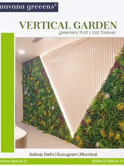 This vertical garden installation uses a diagonal design, creating a dynamic and modern look against the white paneled wall. The integrated lighting further highlights the texture of the artificial leaves.