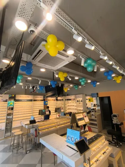 Another view of the interior ceiling decorations at the Lenskart opening, adding pops of color throughout the retail space.