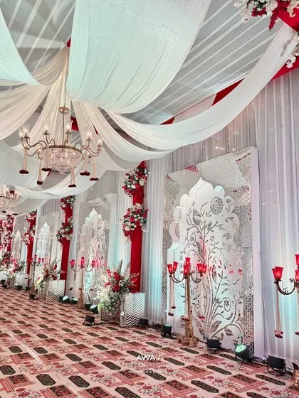 A side view of the walkway, showing the detailed wall panels and floral arrangements.