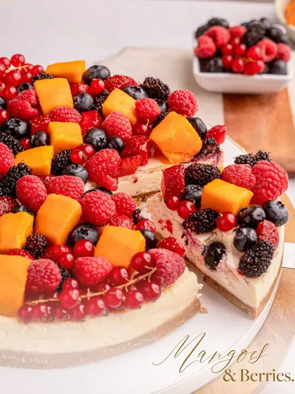 Another view of my Baked Philadelphia Cheesecake with Mango and Berries, a perfect blend of velvety cream cheese and fresh fruit.