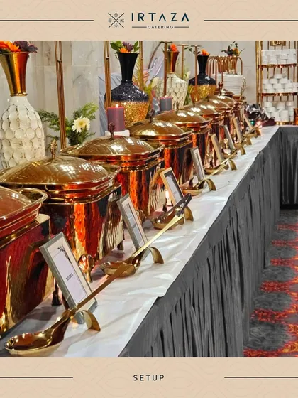 A full buffet line featuring my signature copper-toned chafing dishes with ornate golden handles. The sleek black table skirt provides a modern contrast, suitable for both weddings and corporate functions.