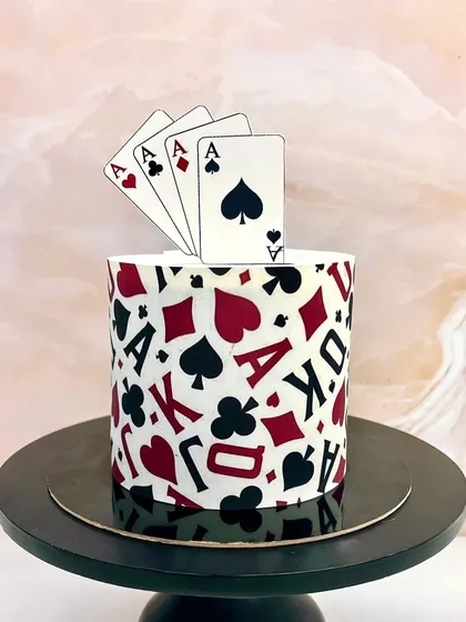 This cake is a real ace. Perfect for someone who loves card games, this design is wrapped in an edible print of playing cards.
