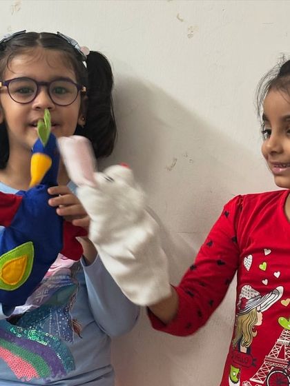 Look at the joy and interaction between these two friends and their new puppets. Creating the puppets is only half the fun; bringing them to life is where their personalities shine.