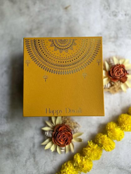 The 'Warmth' hamper is a simple yet elegant gift for Diwali. The beautiful yellow box is designed to bring a smile to anyone's face.