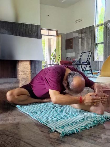 A seated forward bend, Janu Sirsasana.