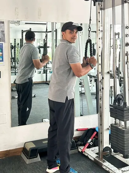 Another angle of the tricep pushdown, highlighting the engagement of the arm muscles.