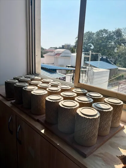 These carved tumblers were also part of the Lagavi collection, drying on the studio window sill before being fired.