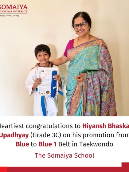 Hiyansh Bhaskar Upadhyay proudly holds his certificate and new Blue 1 Belt in Taekwondo.