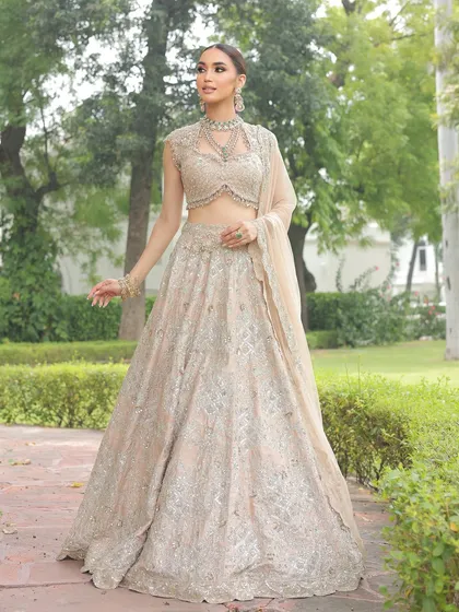 The complete look, showing how a minimal lehenga can create a powerful and poetic bridal statement, perfect for an outdoor wedding.