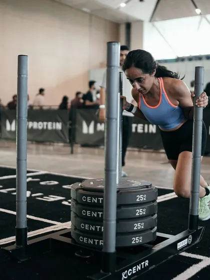 This is what "Strong > Skinny" looks like in action. My coaching focuses on progressive overload with strength workouts like this sled push. We build muscle to boost your metabolism, so you look toned and feel powerful, not just smaller.